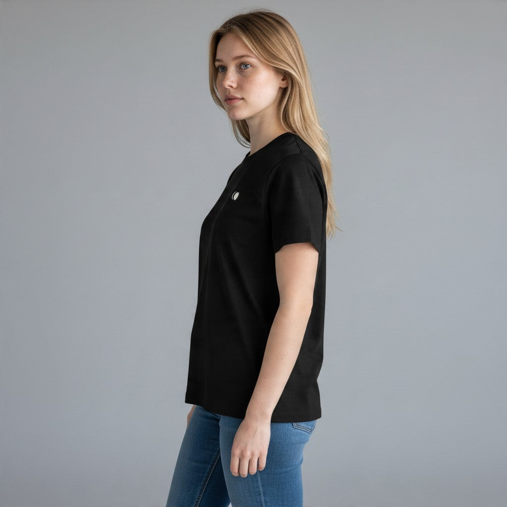 Woman wearing an All Back Moon black heavyweight cotton crew neck t-shirt with a small moon graphic on the chest