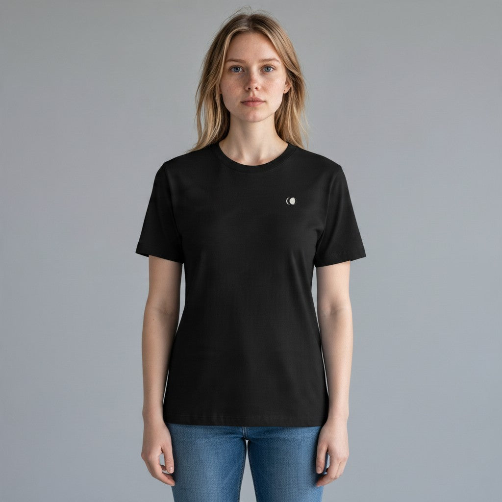Woman wearing an All Back Moon black heavyweight cotton crew neck t-shirt with a small moon chest embroidery